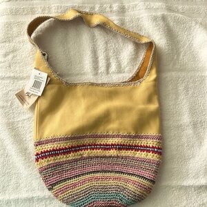 The Sak yellow leather Hobo bag. Never used.  Tags still on it.